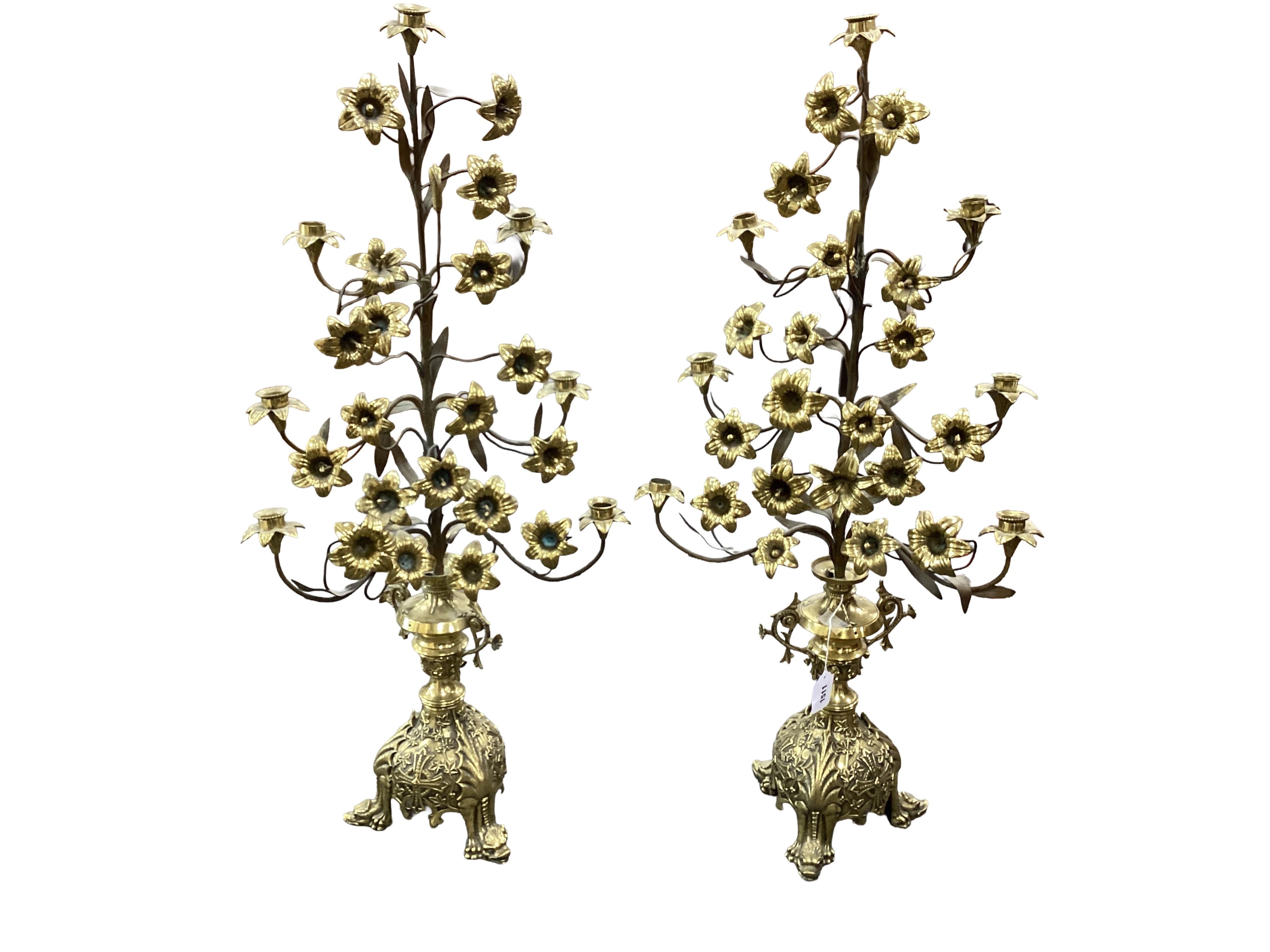 A pair of ornate French floral seven branch, brass church candelabra, 99cm high
